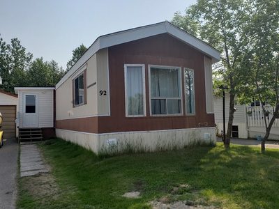 A mobile home for sale in a residential area.