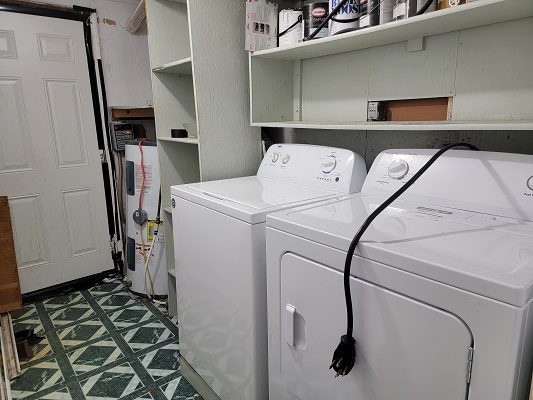 A laundry room with a washer and dryer.