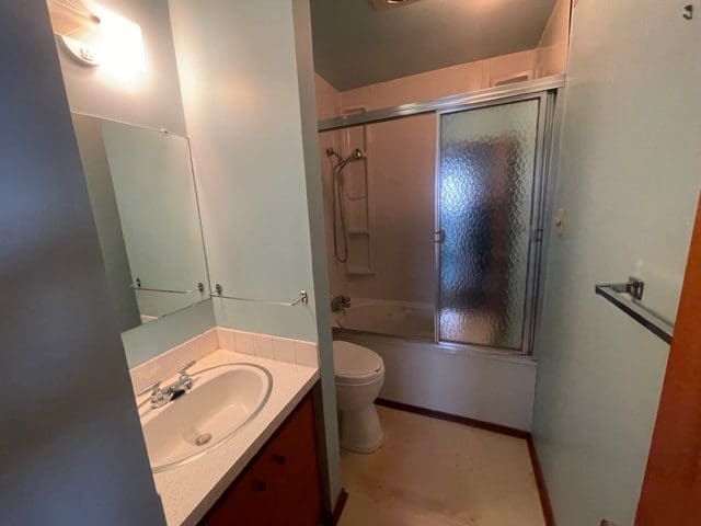 A bathroom with a sink, toilet and shower.