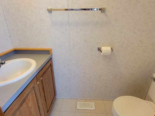 A small bathroom with a toilet and sink.