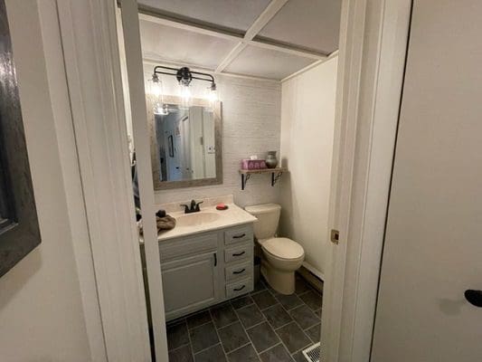 A small bathroom with a toilet and sink.