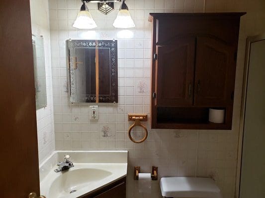Bathroom Sink Area With Wooden Cabinet