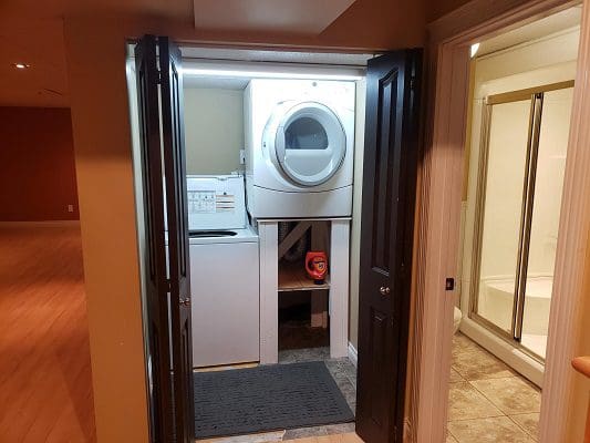 A laundry room with a washer and dryer.