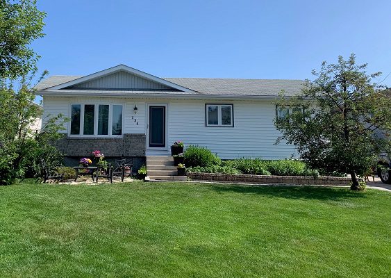 White Single-Family Home With Yard