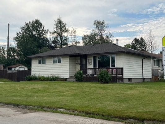 White Single-Level Home With a Front Porch