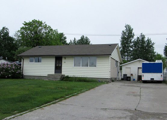 White Bungalow With Detached Garage