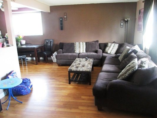 A living room with couches and a coffee table.