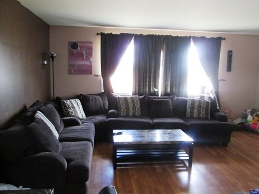 A living room with couches and a coffee table.