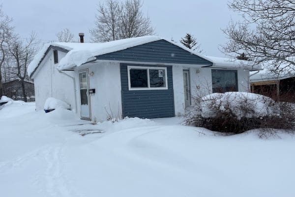 A house is covered in snow and covered in snow.