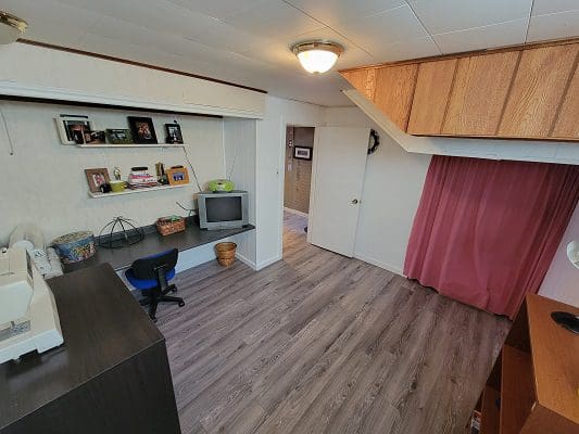 A room with a desk and a computer.