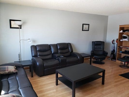 A living room with couches and a coffee table.