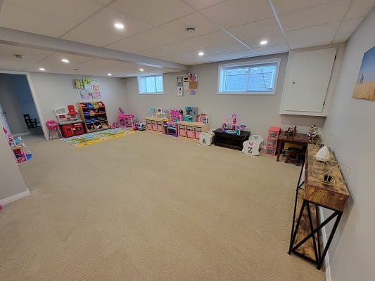 A child's playroom with lots of toys.