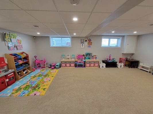A child's playroom with lots of toys.