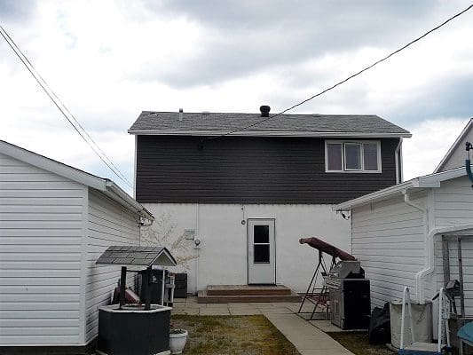 A house with a garage and a washer and dryer.