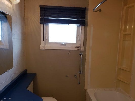 A small bathroom with a toilet and sink.