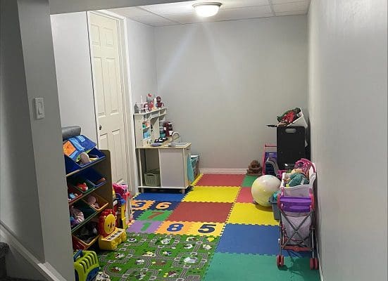 A child's playroom with a lot of toys.