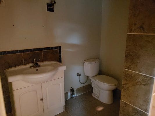 A small bathroom with a toilet and sink.