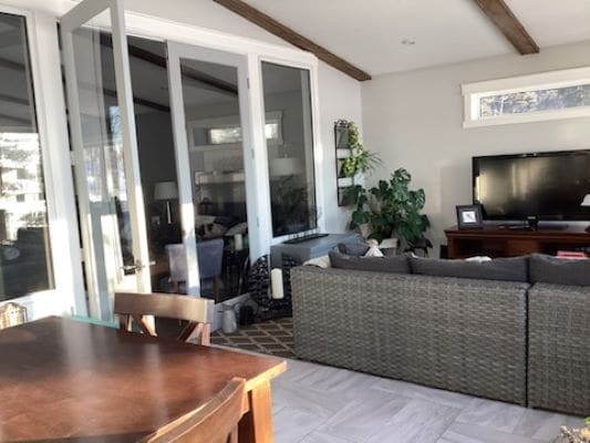 A living room with a couch and tv.