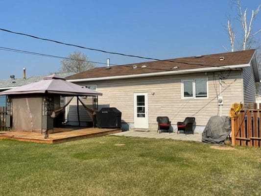 A backyard with a gazebo and a gazebo.