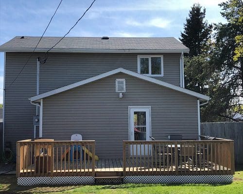 A house with a deck and a porch.