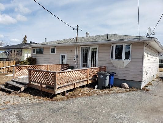 A house with a front porch and a driveway.