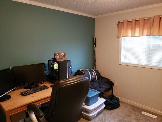 A home office with a desk and computer.