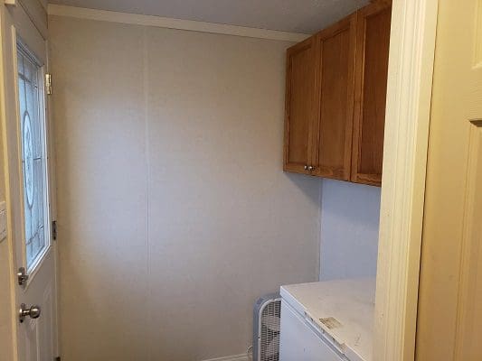 A laundry room with a washer and dryer.