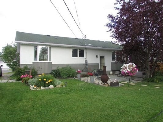 A house with a lawn in front of it.
