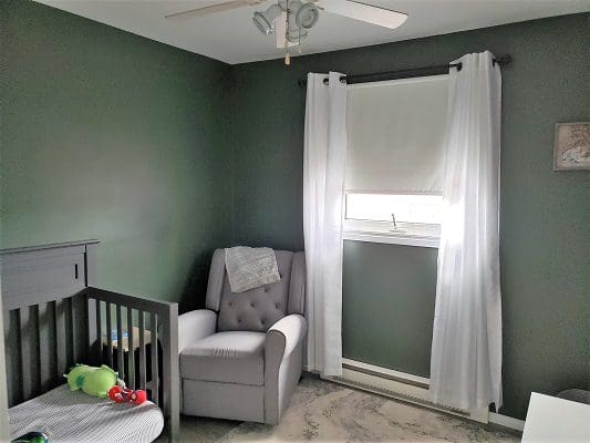 Baby's nursery with crib and recliner.