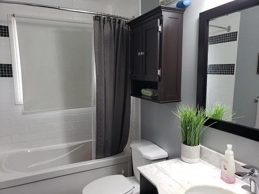 Bathroom with bathtub, shower, and vanity.