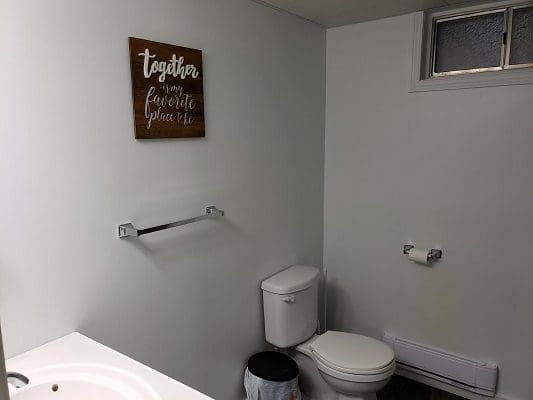 Bathroom with "Together is my favorite place to be" sign.