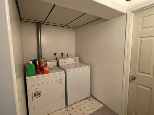 Basement laundry room with washer and dryer.