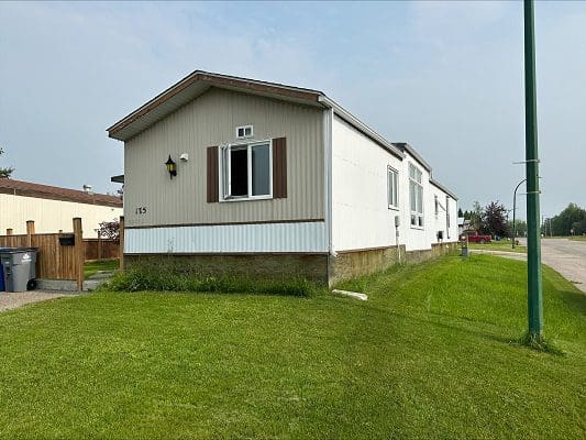 Beige mobile home with brown trim.