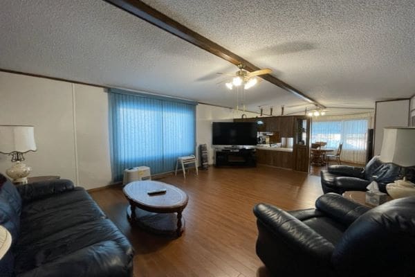 Spacious living room with leather furniture.