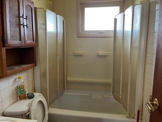Bathroom with shower and toilet.