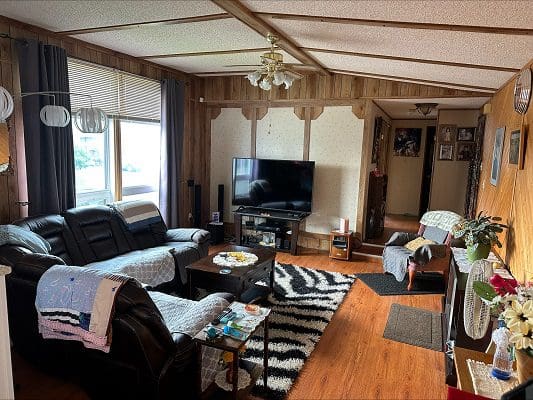 Living room with sectional sofa and TV.