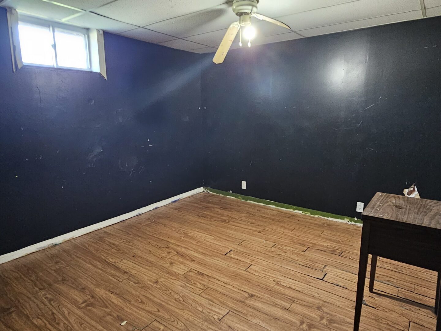 Black Room With Wooden Floors