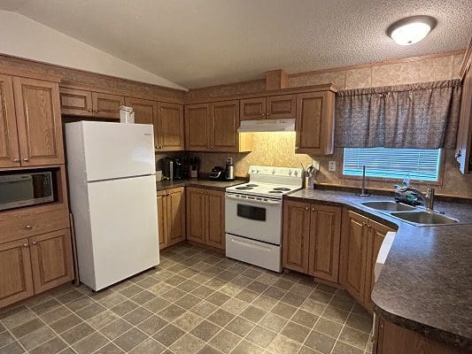 Mobile home kitchen with appliances.
