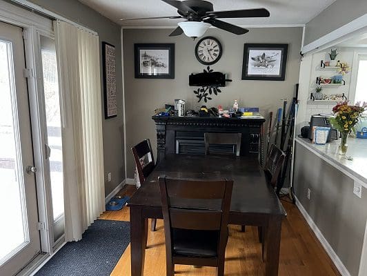 Dining room with fireplace and sliding doors.