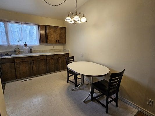Kitchen with table and chairs.