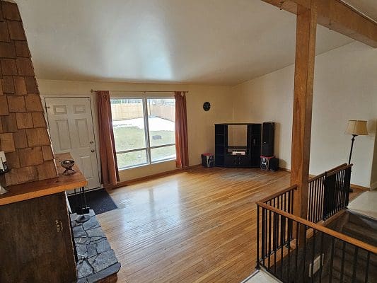 Spacious living room with hardwood floors.
