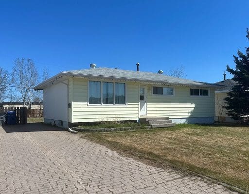 Yellow bungalow house for sale.