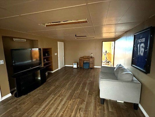 Basement room with TV and couch.