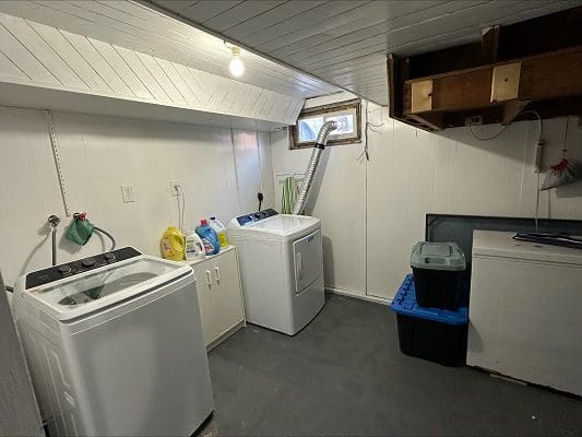 Basement laundry room with washer and dryer.