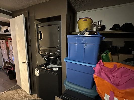 Stacked washer dryer, storage bins.