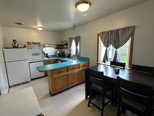 Kitchen with island and dining table.