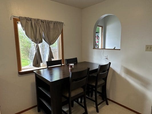 Dining room table with four chairs.