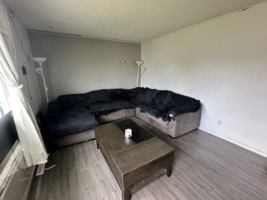 Living room with sectional sofa and coffee table.