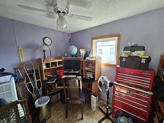 Home office with computer and tools.