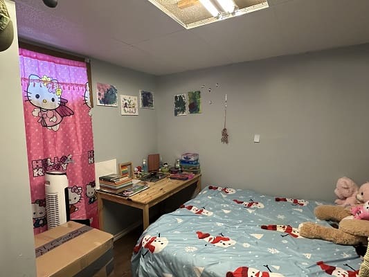 Girl's bedroom with Hello Kitty decor.
